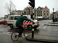 A bicycle waiting to cross at the light