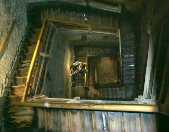 Looking down the wooden stairway up the tower