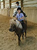 Here I am riding on 'Nugget'.  You pull the 'strings' to make the pony stop (I am still working on turns)