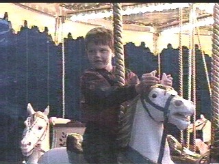 With the way he's holding this horse, he's lucky it can't bite