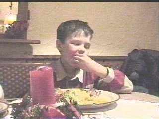 Alex eating french fries while sleeping