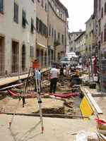 Public works take on new meanings in an ancient town.  This road repair had become an archealogical dig