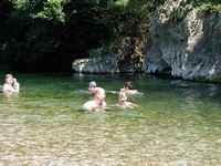 Brian and Juli swim together through a deep pool